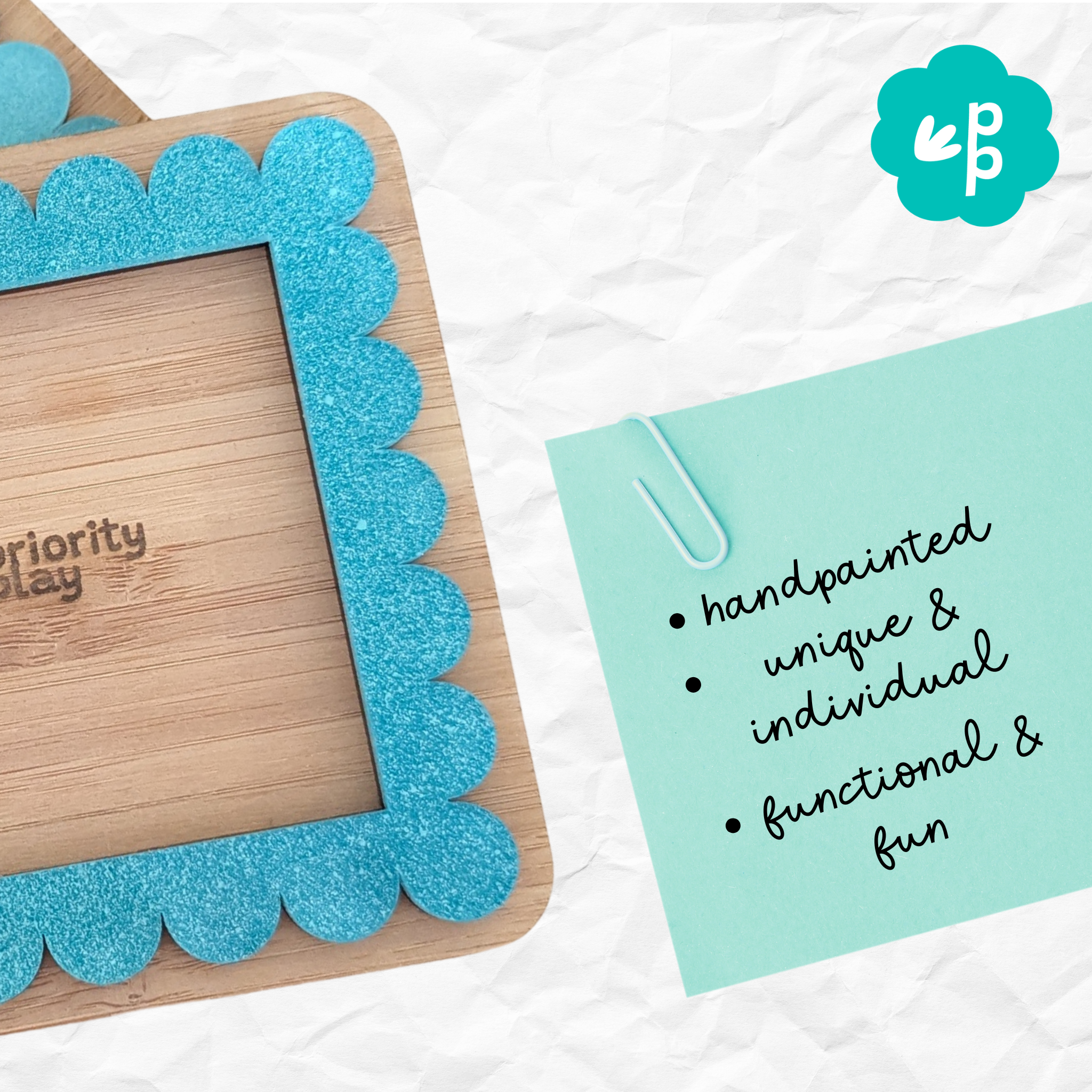 Handmade teal acrylic and bamboo Post-It note holder with a scalloped design — a minimalist, eco-friendly stationery piece for your workspace by Priority Play.