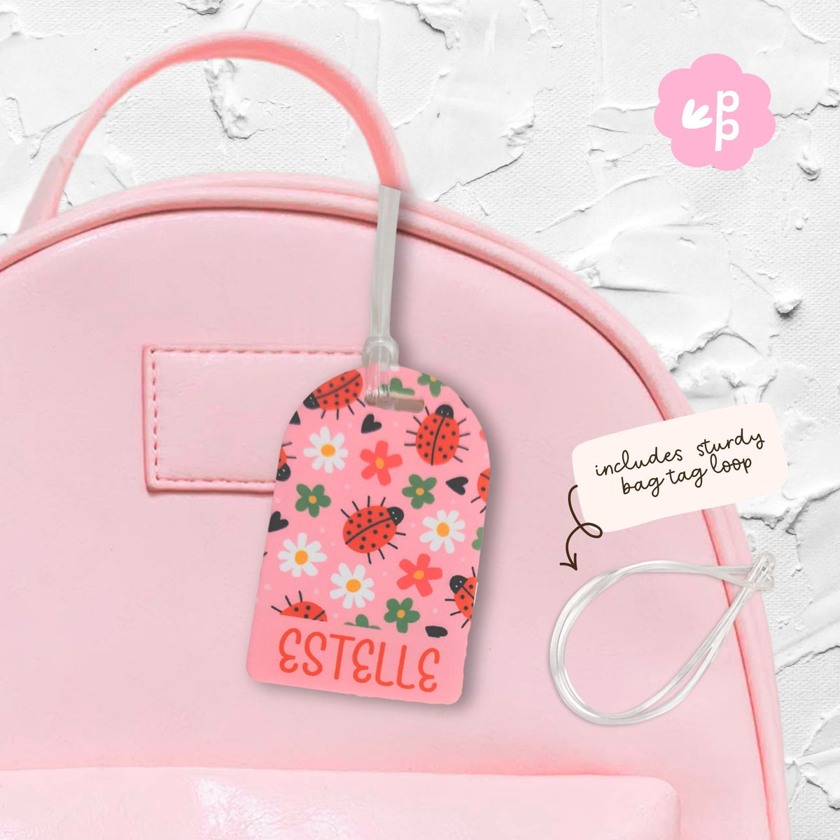 Personalised kids bag tag attached to pink school bag with clear loop, custom name luggage tag by Priority Play