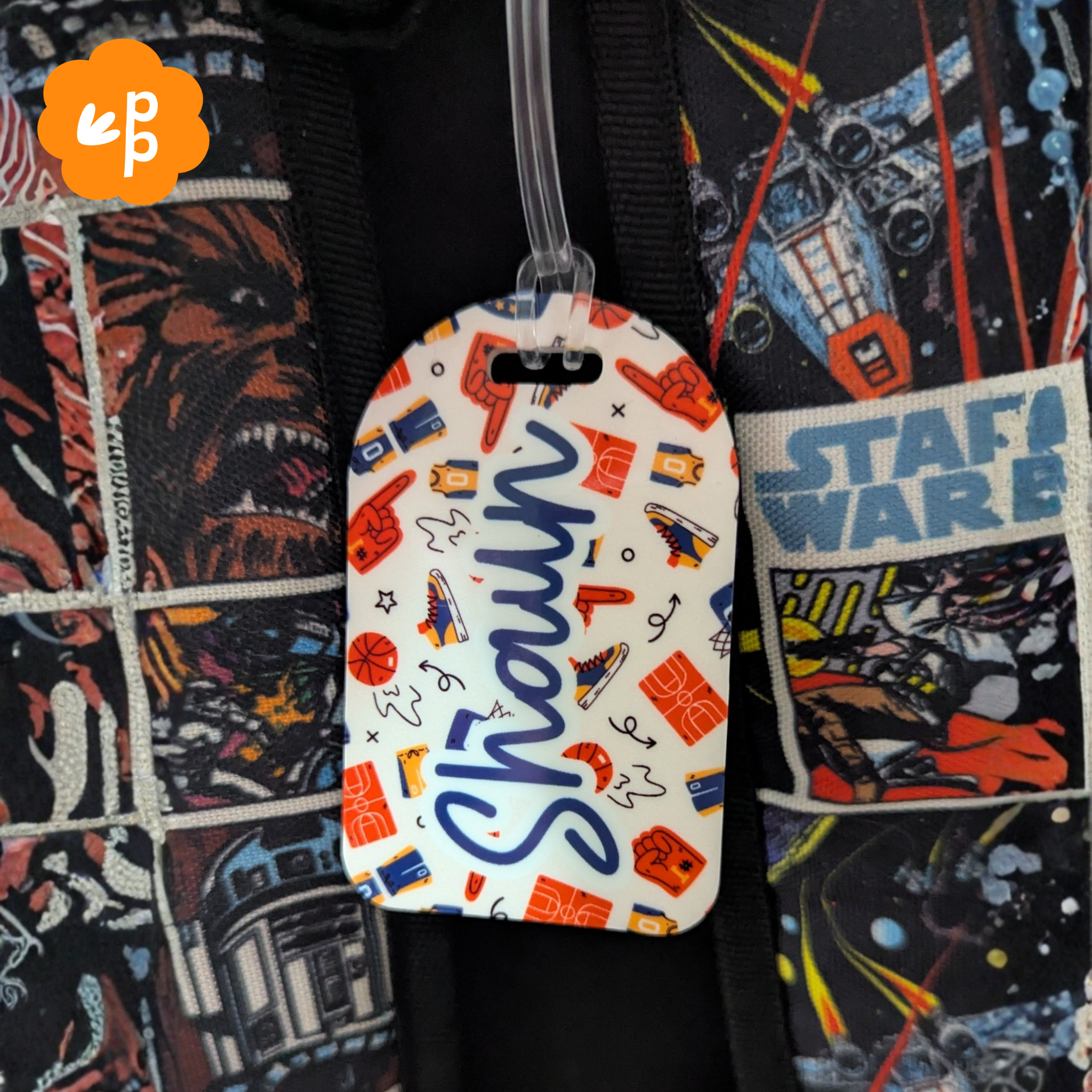 Personalised kids bag tag attached to school backpack with bold sports themed pattern and custom name by Priority Play