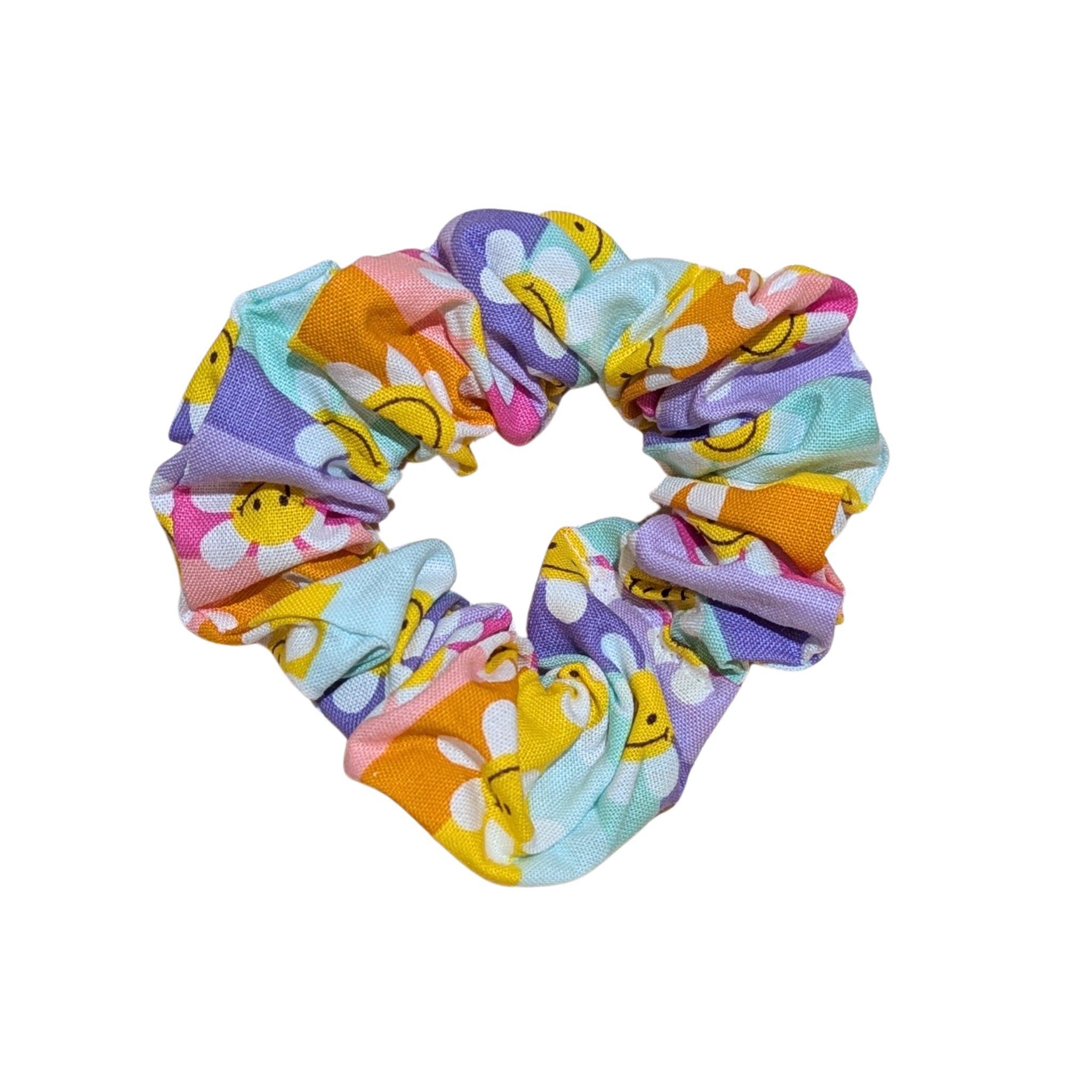 Handmade pastel scrunchie with smiling daisy flower pattern