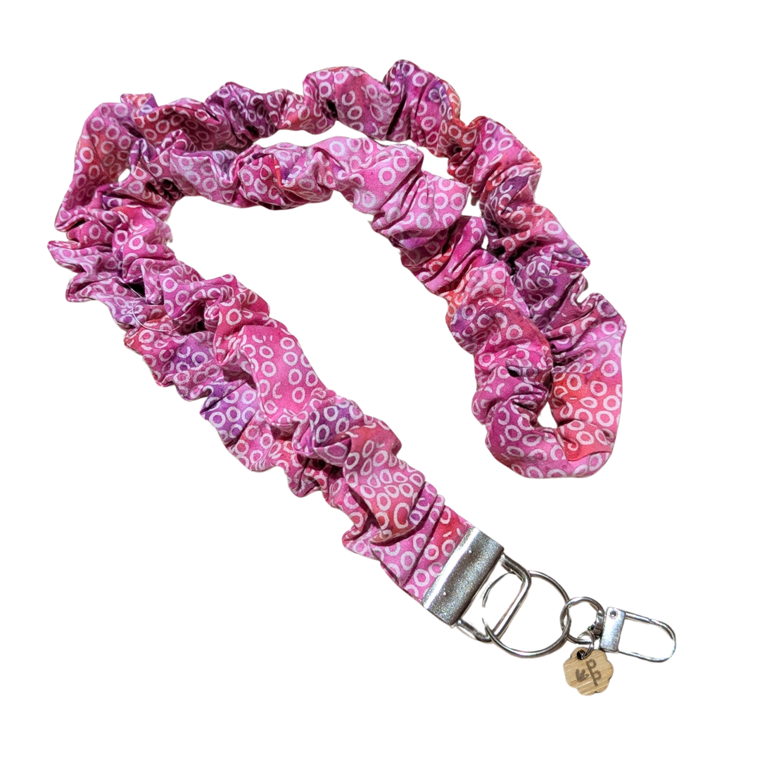Pink scrunchie lanyard with a metal clip on a white background for teachers