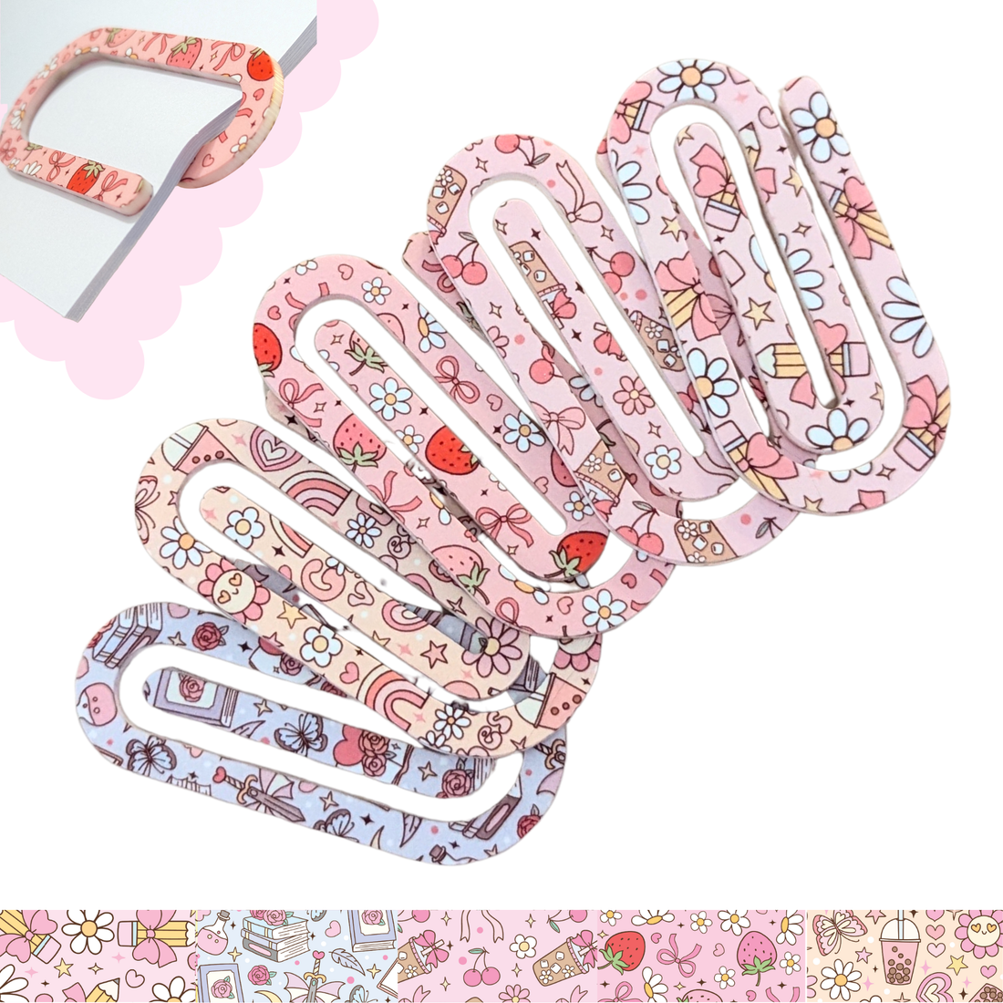 Cute pink patterned oversized acrylic paper clips with hearts, strawberries, and daisies – decorative stationery accessories.