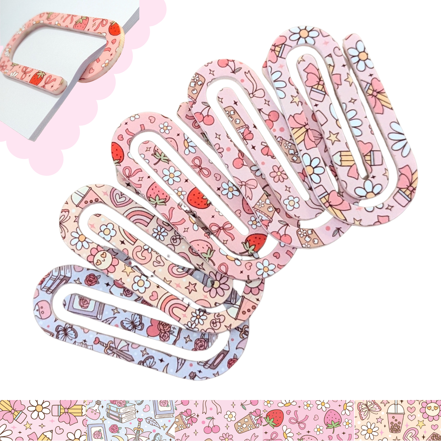 Cute pink patterned oversized acrylic paper clips with hearts, strawberries, and daisies – decorative stationery accessories.