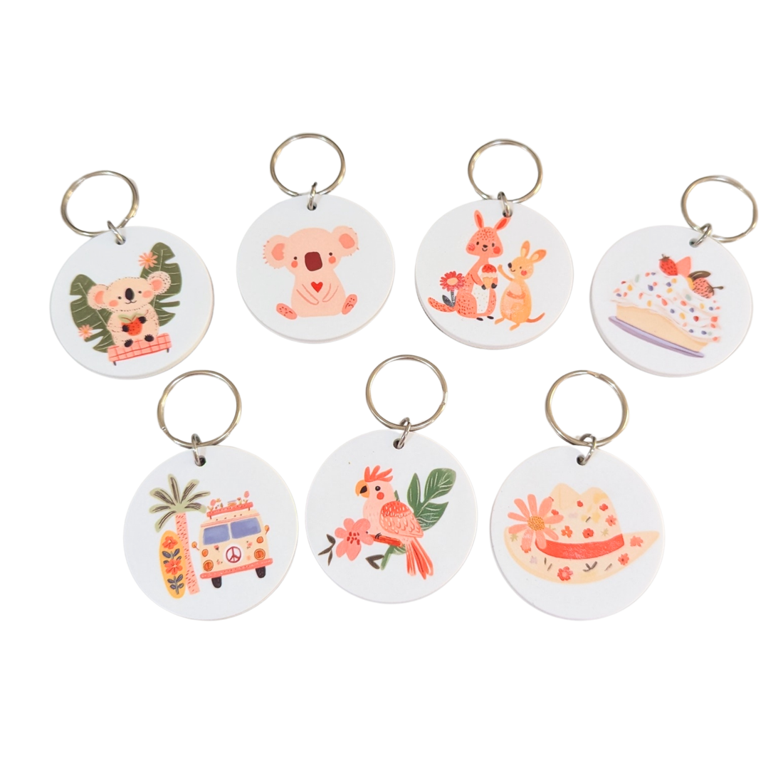 Collection of round bamboo keyrings featuring Australian animals and icons like koalas, kangaroos, and galah parrots.