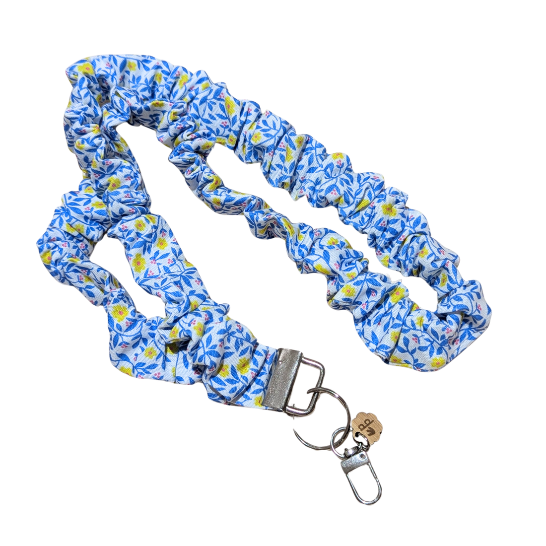 Blue floral patterned lanyard with keychain on a white background