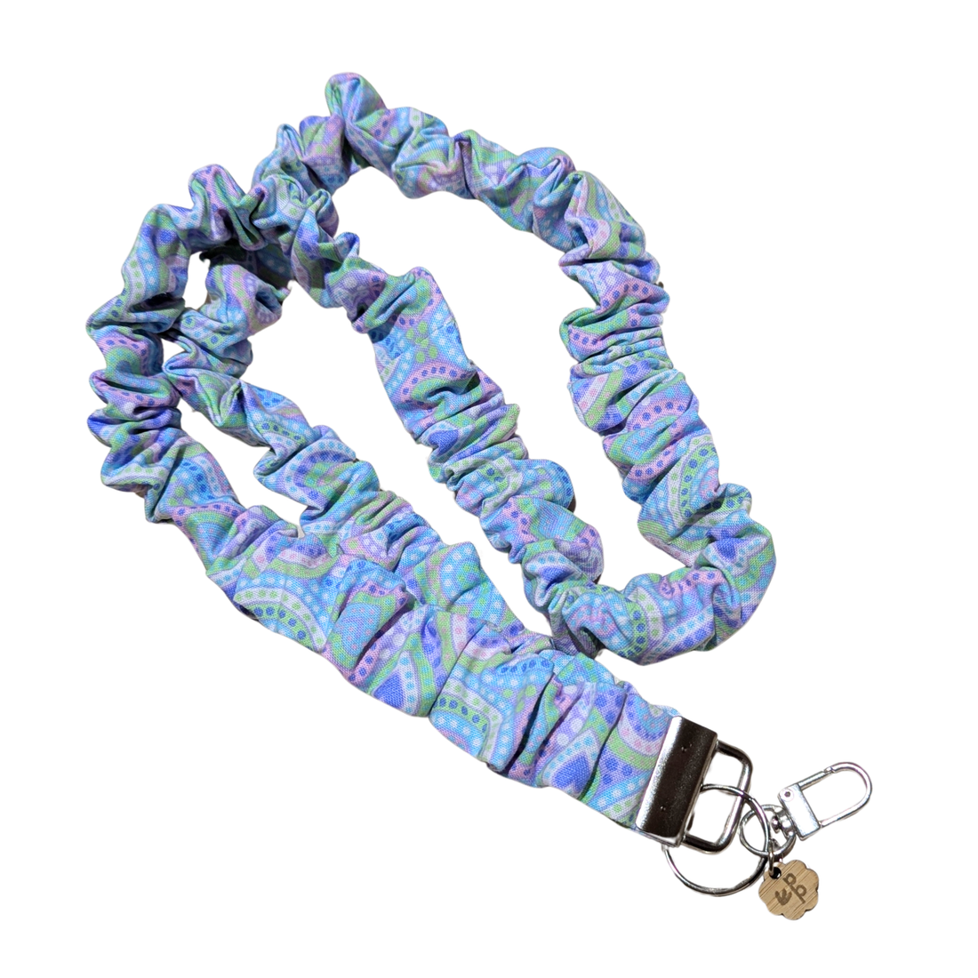 Blue and purple patterned teacher lanyard with a keychain on a white background and silver clasp