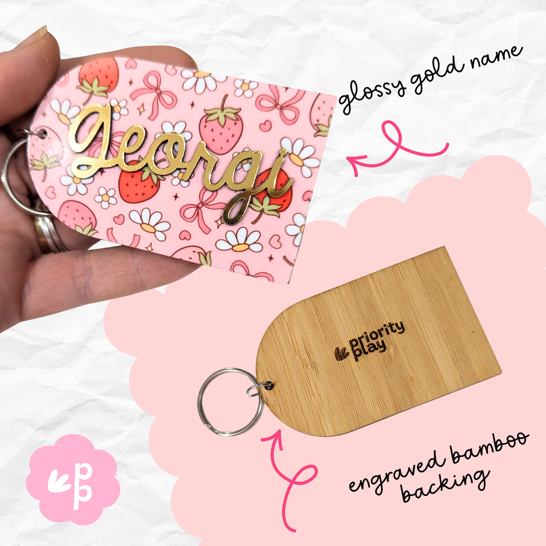 Close-up of custom gold name keyring with pink floral pattern and engraved bamboo backing, a stylish personalised teacher gift from Priority Play.