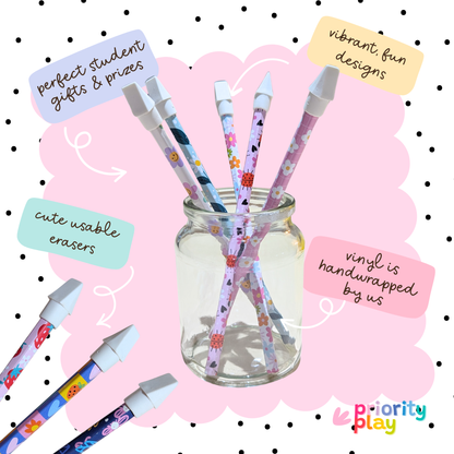 Floral vinyl wrapped pencils in a glass jar featuring ladybirds, daisies, and pastel flowers – cheerful stationery gift set for kids.