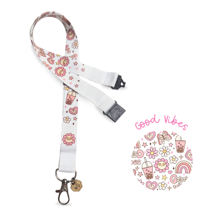 Lanyard with floral and drink designs on a white background