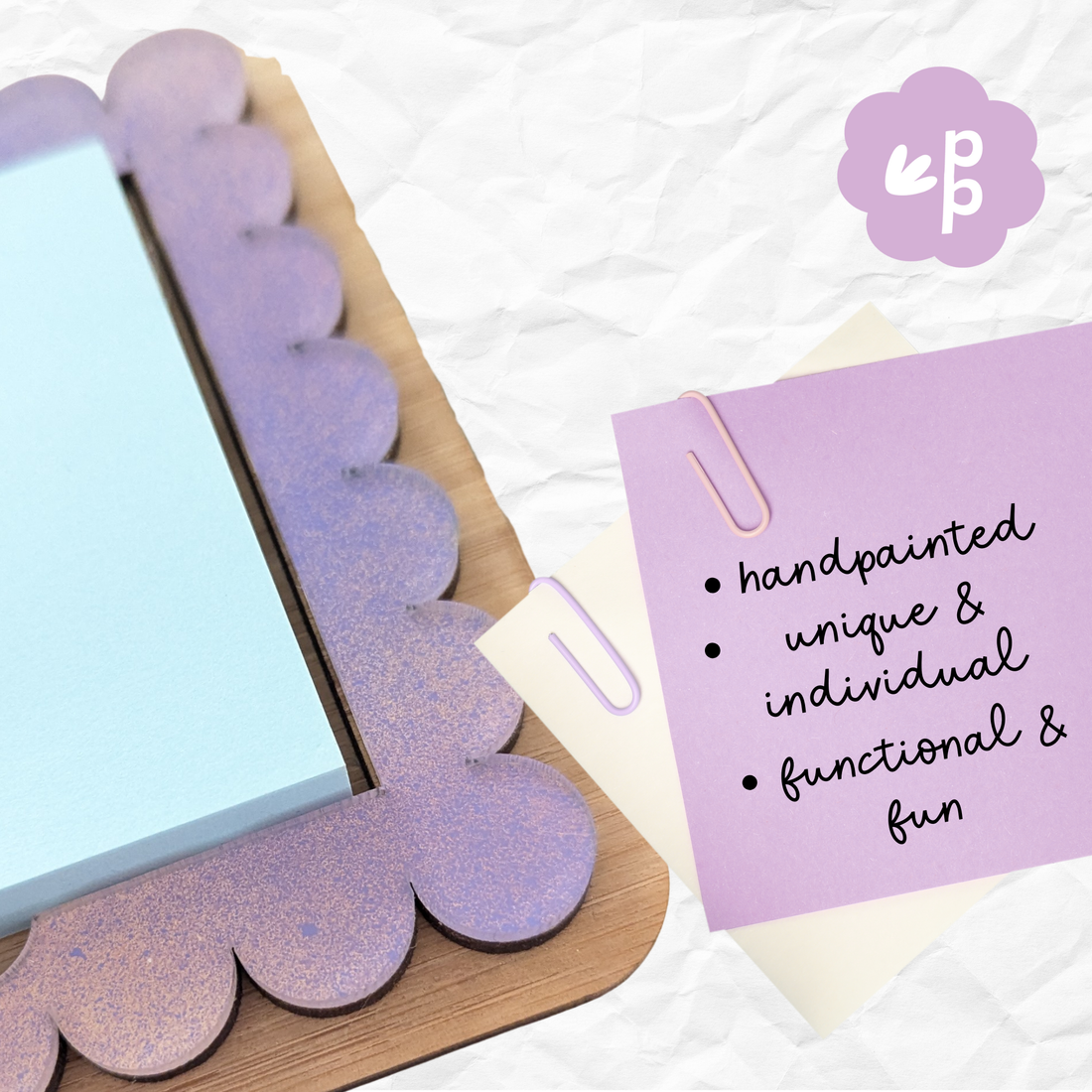 Hand-painted purple acrylic and bamboo Post-It note holder with scalloped edges, shown holding blue sticky notes — eco-friendly handmade stationery by Priority Play.