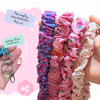 Handmade fabric key fob lanyards for teachers in pink and purple floral and strawberry prints with strong silver hardware