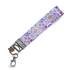 Handmade fabric wristlet keychain with pink heart and leaf print, a sweet gift for teachers.