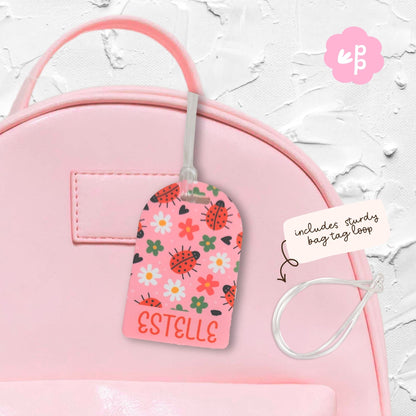 Personalised kids bag tag attached to pink school bag with clear loop, custom name luggage tag by Priority Play