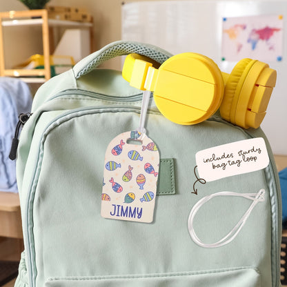 Personalised kids bag tag attached to backpack with clear loop, custom name luggage tag for school bags by Priority Play