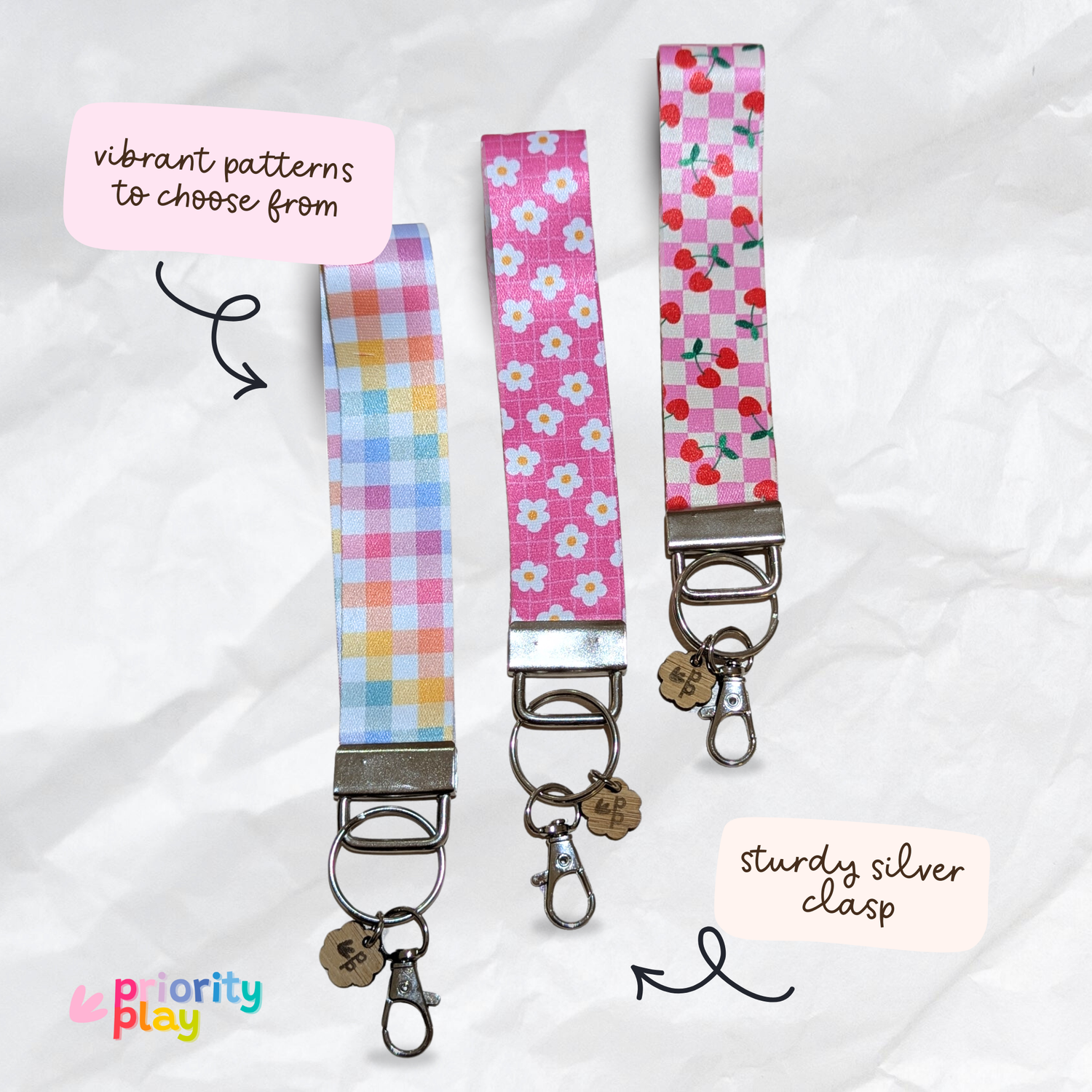 Colourful pastel, daisy, and cherry pattern fabric wristlet keychains with sturdy silver clasp, handmade teacher gifts.