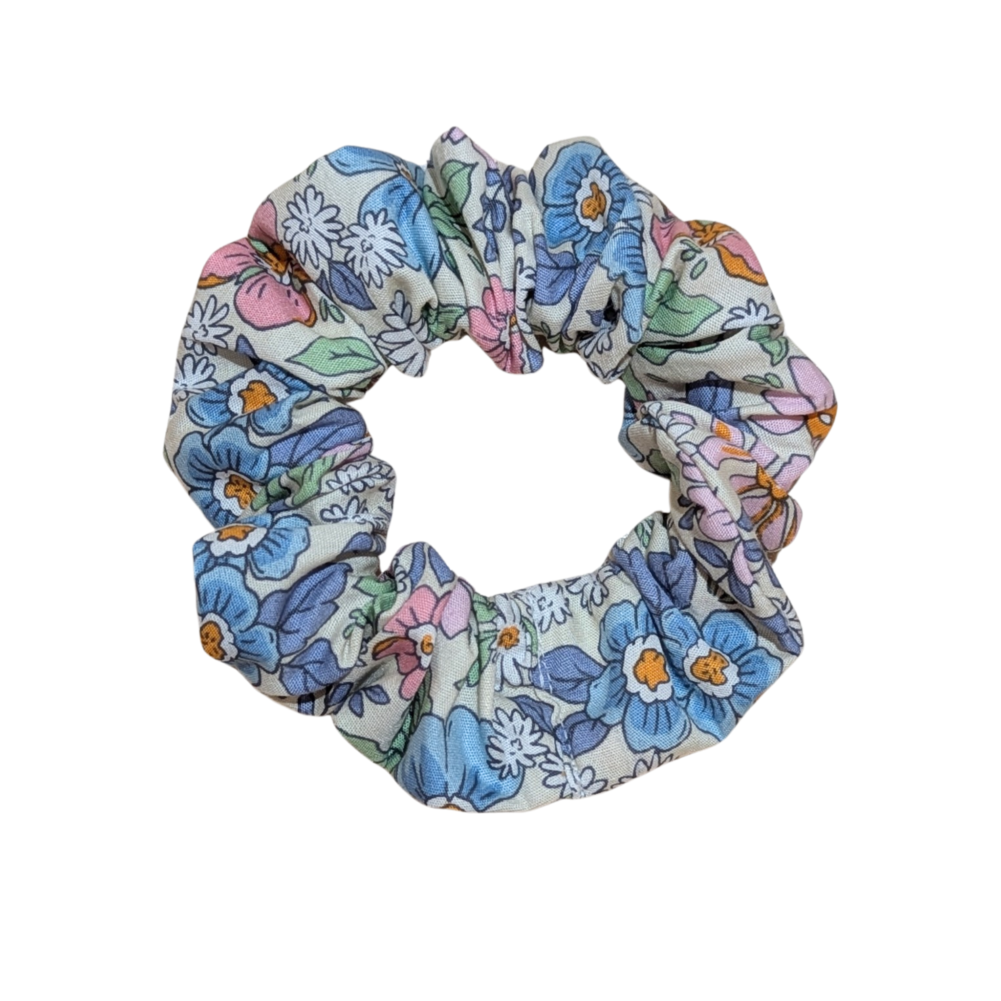Handmade scrunchie with soft pastel floral pattern in blue and pink tones