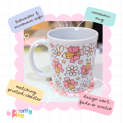 Flatlay of pencil and daisy design ceramic mug with matching printed coaster from Priority Play.