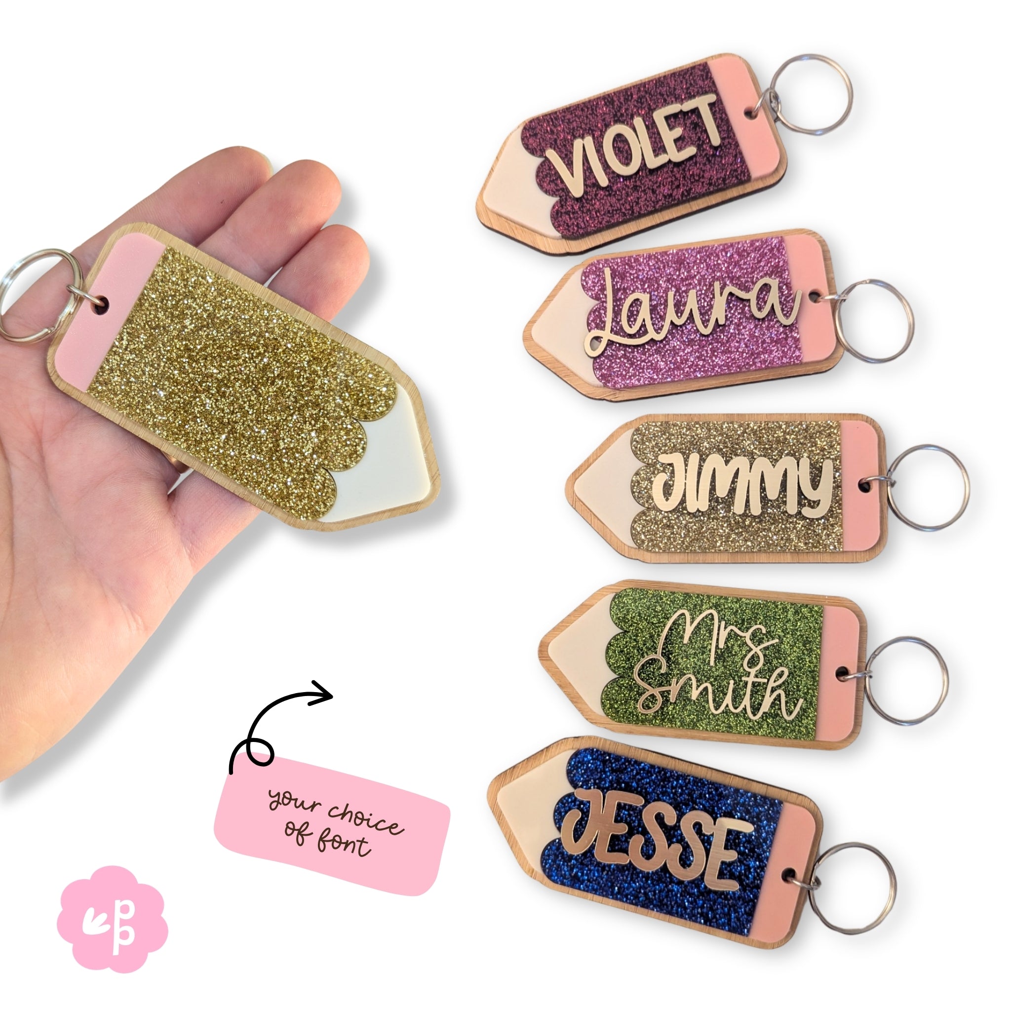 Personalised glitter acrylic name keyrings with bamboo backing and custom names, colourful teacher keychain gift by Priority Play