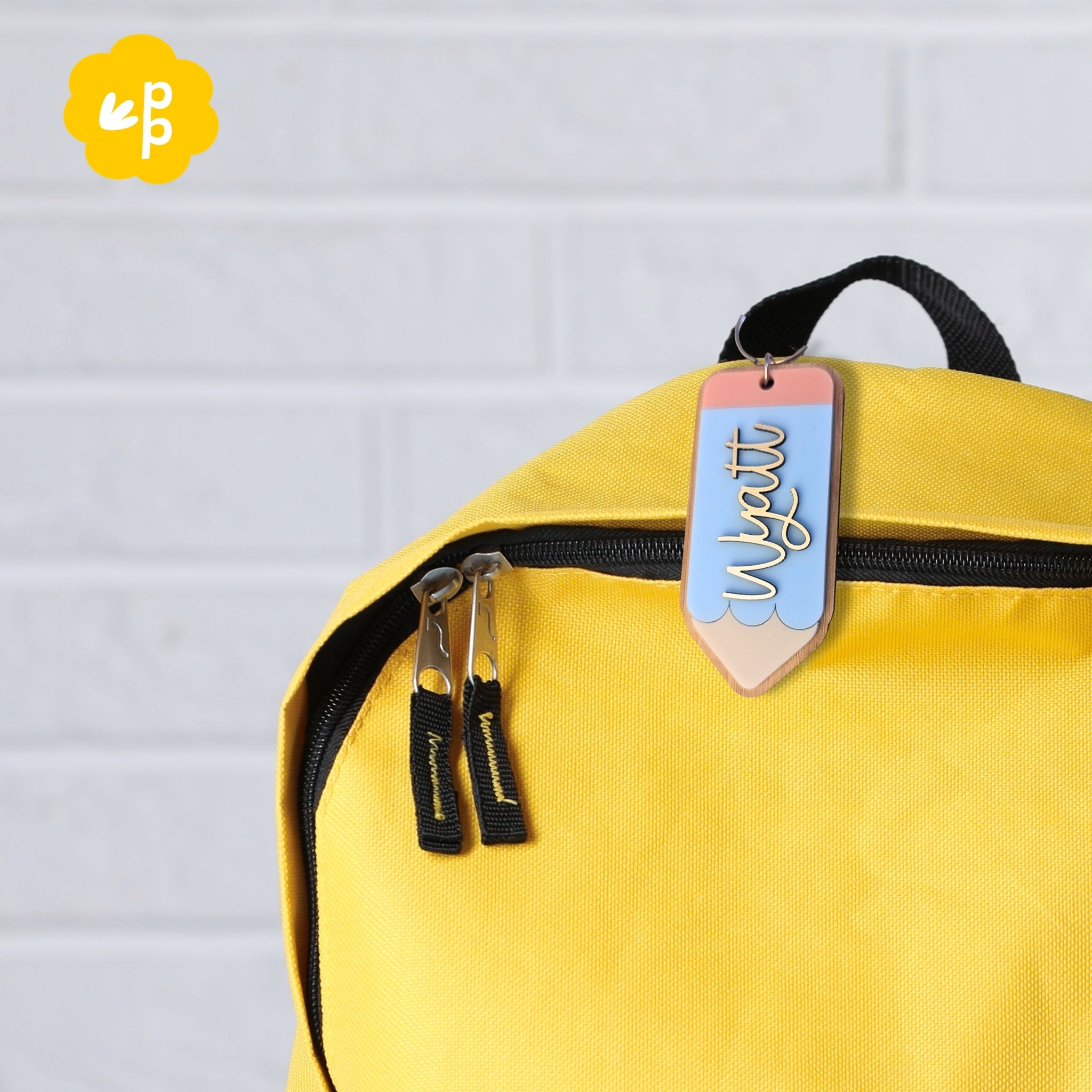 Custom pencil name keyring attached to school bag zip, personalised bag tag for kids or teachers in pastel colours