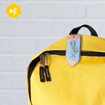 Custom pencil name keyring attached to school bag zip, personalised bag tag for kids or teachers in pastel colours