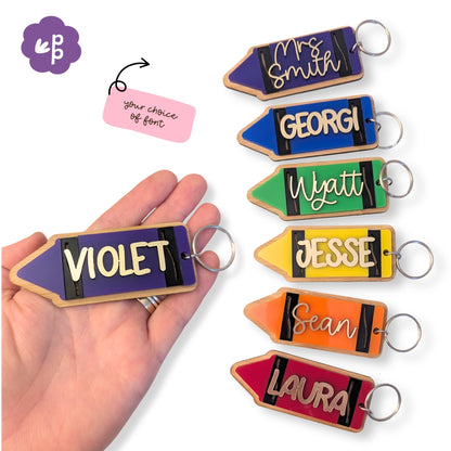 Personalised crayon name keyring with bamboo backing and colourful acrylic design, custom name in gold lettering, perfect for teachers, students and school bags