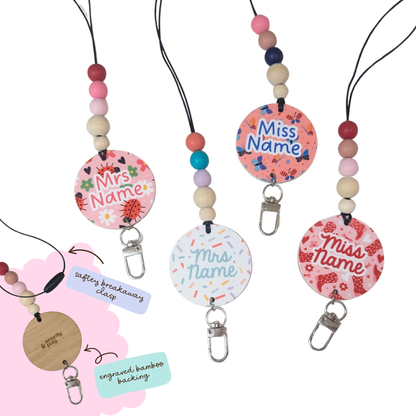 Personalised teacher lanyard with ladybug and floral patterns, custom name tag and colourful silicone beads with engraved bamboo backing