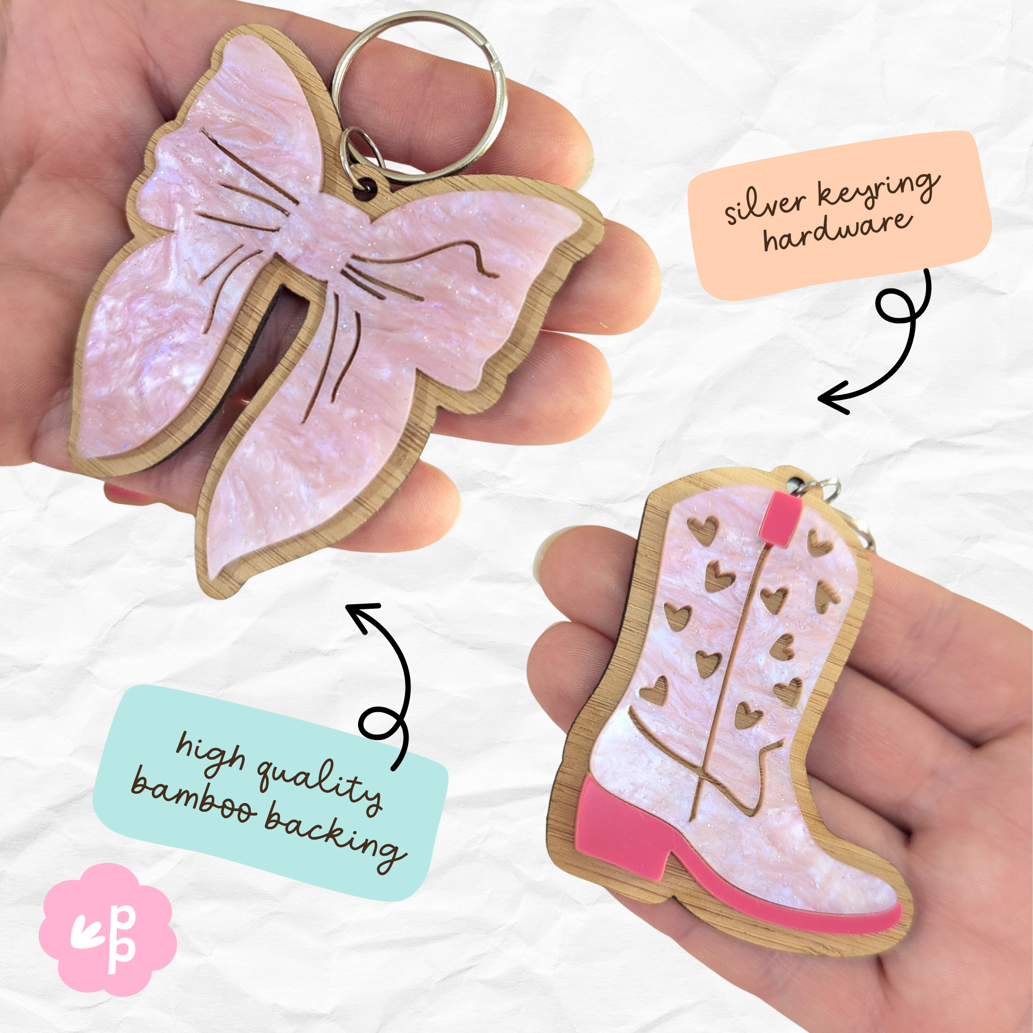 Pink bow keyring with bamboo backing and silver hardware – stylish acrylic design by Priority Play.