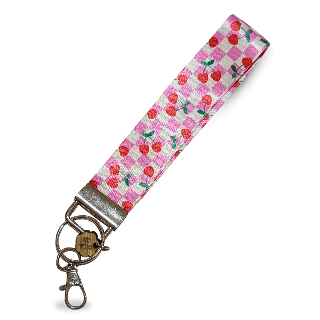 Pink gingham fabric wristlet with cherry pattern, handmade and perfect for keychains or small gifts.