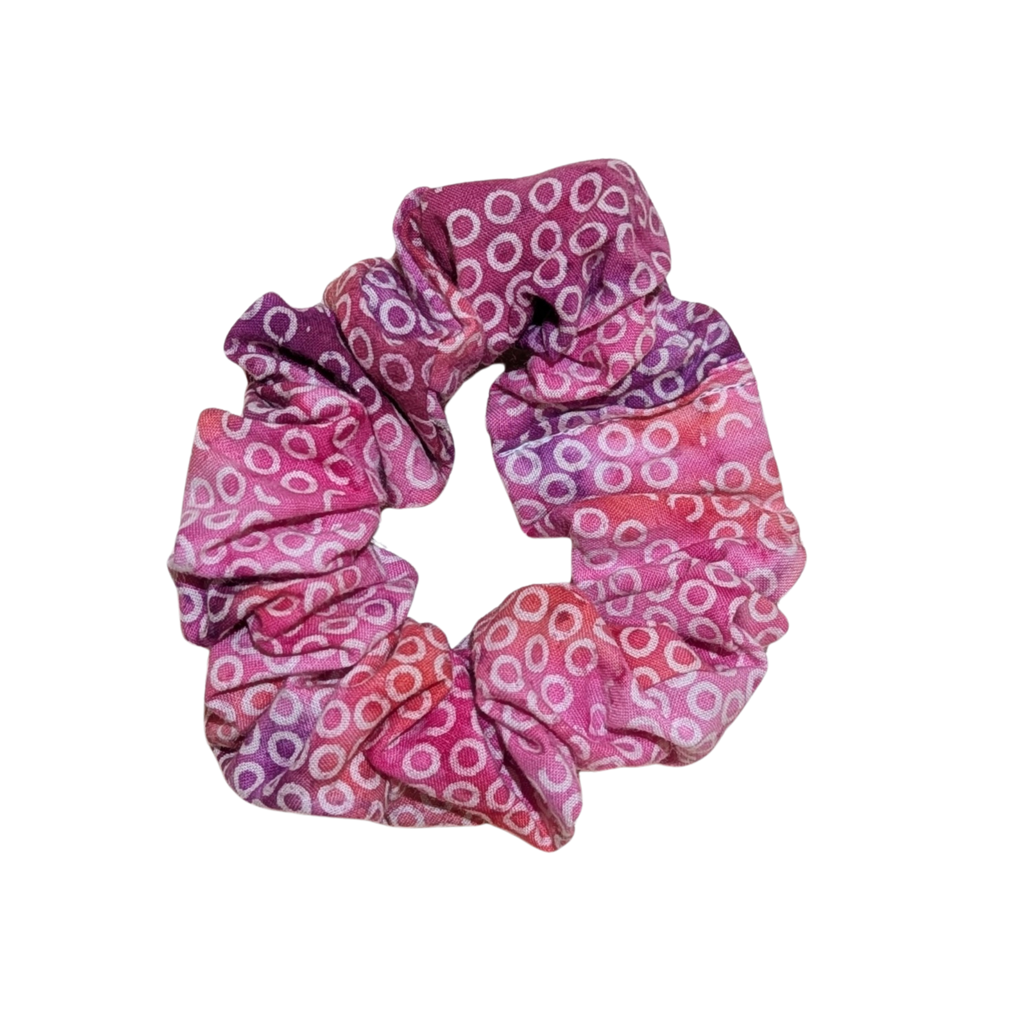 Handmade pink scrunchie with circular pattern in pink and purple shades