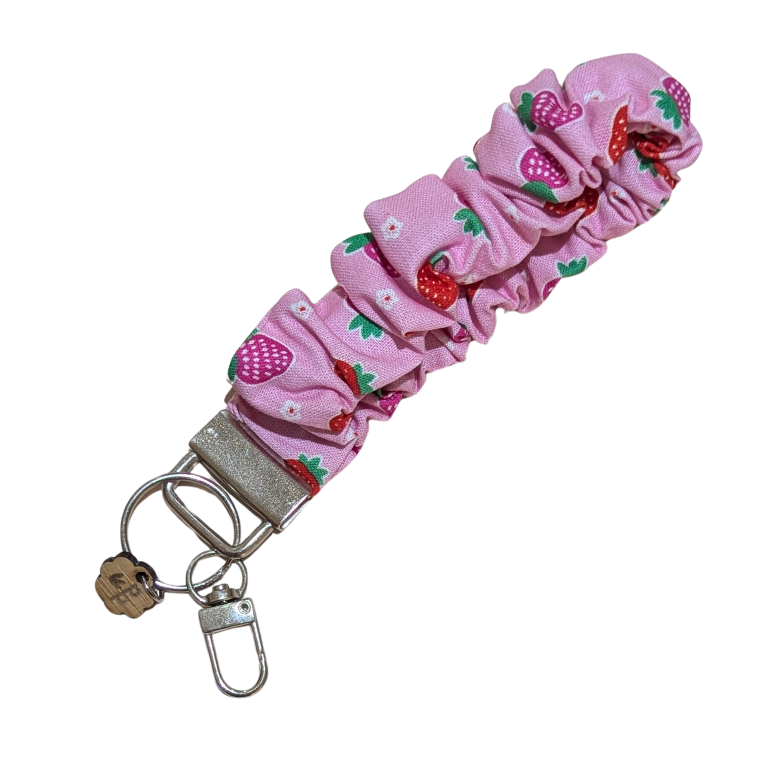 Handmade pink scrunchie wristlet with strawberry print — fun and fruity fabric keychain, great as a teacher gift.