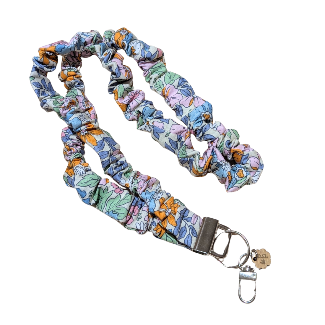 Floral patterned lanyard with a keychain on a white background