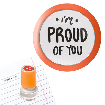 Priority Play “I’m Proud of You” teacher stamp with orange border on lined school paper.
