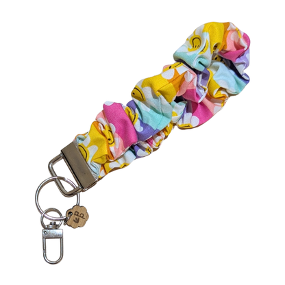 Handmade scrunchie wristlet with colorful rainbow flower pattern — cheerful and unique keychain for teachers.