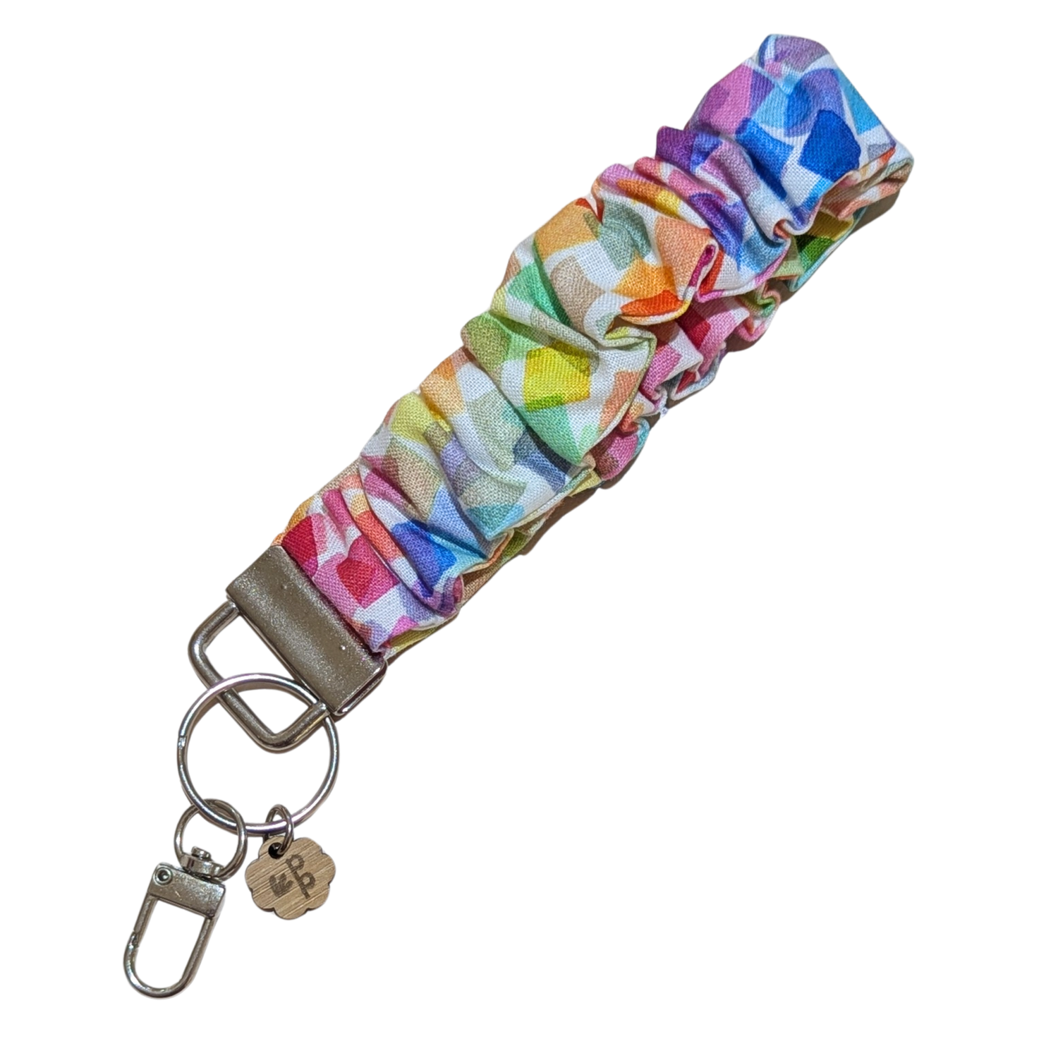 Handmade rainbow geometric scrunchie wristlet keychain — bright and vibrant gift idea for teachers.