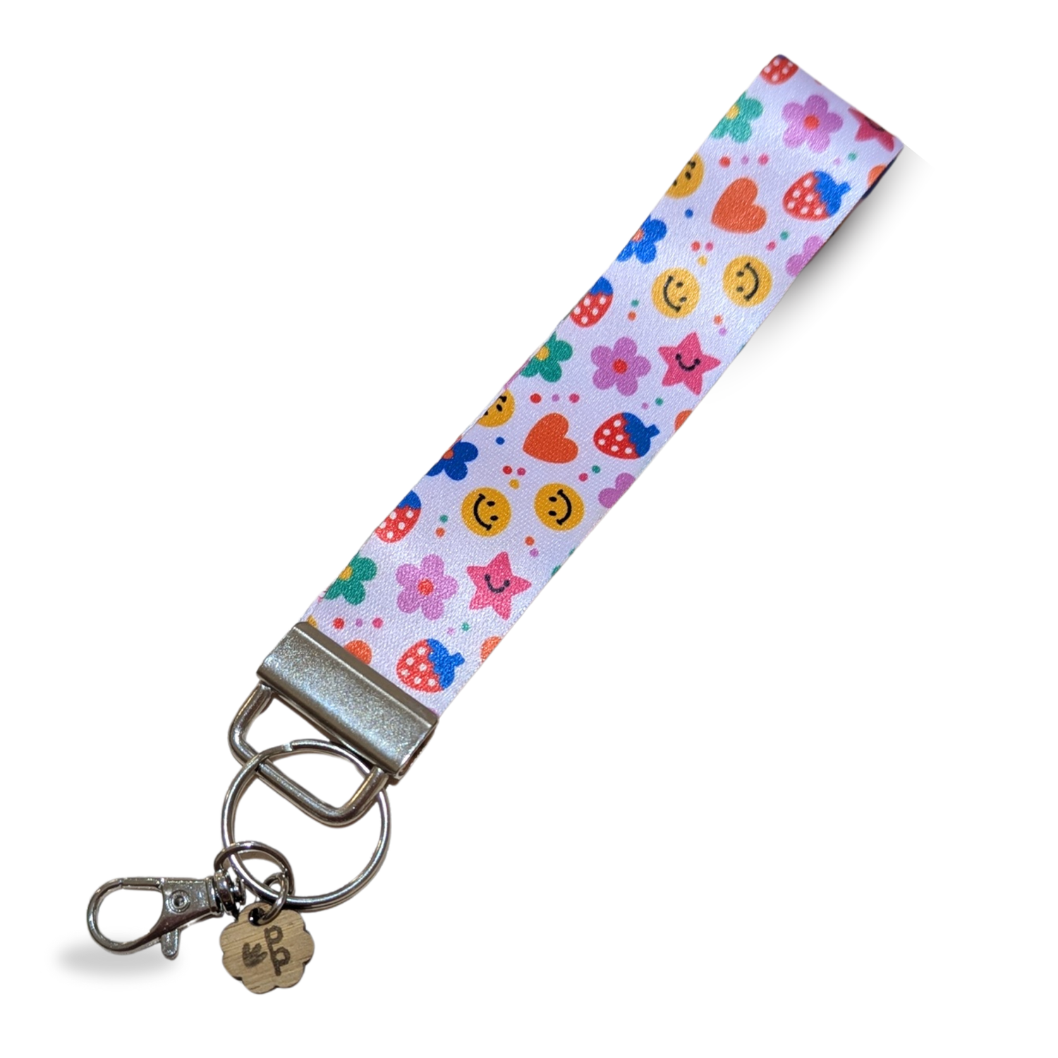 Colorful smiley face and flower print fabric wristlet keychain, handmade and fun teacher gift.