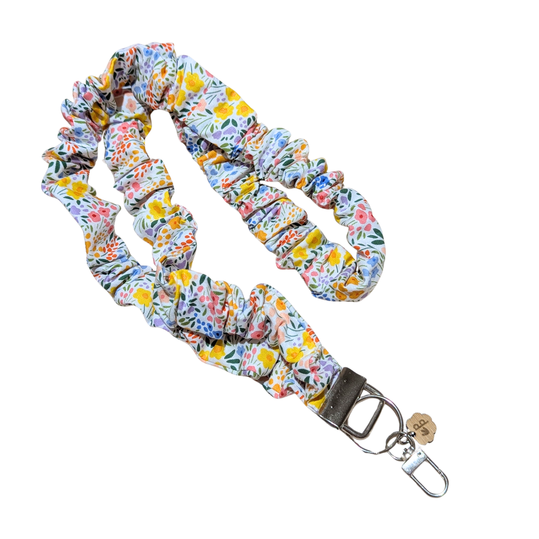 Floral patterned scrunchie lanyard with a keychain attachment on a white background