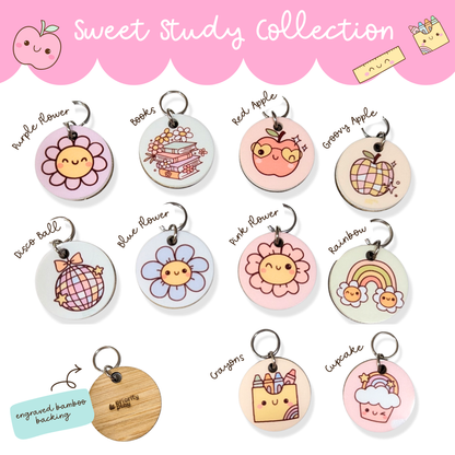 Sweet Study Collection of cute lanyard charms featuring flower, apple, rainbow, and cupcake designs with engraved bamboo backing — fun classroom lanyard accessories for teachers and students.