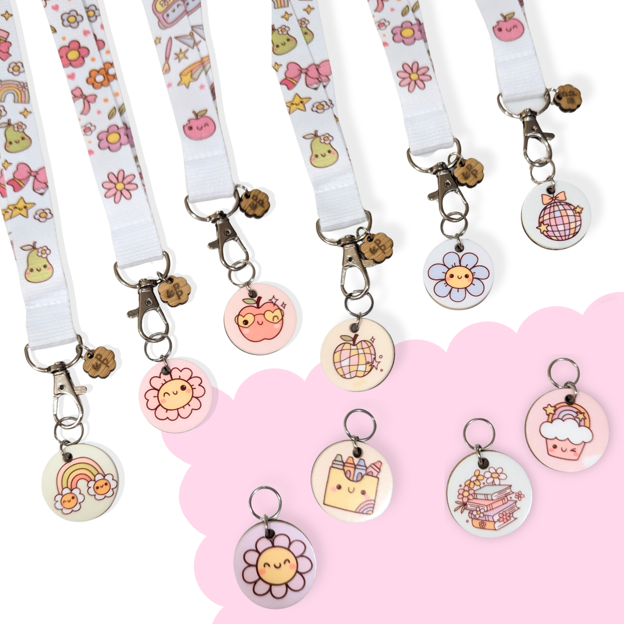 Sweet Study Collection lanyards with matching charms — pastel rainbow, flower, apple, and cupcake designs that add a touch of fun and personality to teacher lanyards.