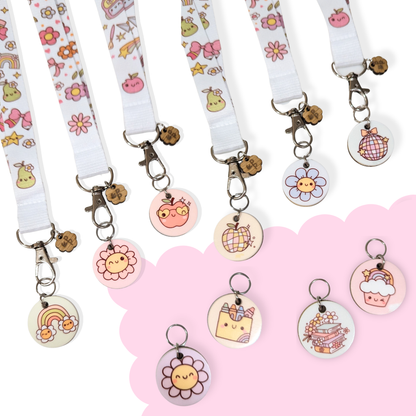 Sweet Study Collection lanyards with matching charms — pastel rainbow, flower, apple, and cupcake designs that add a touch of fun and personality to teacher lanyards.