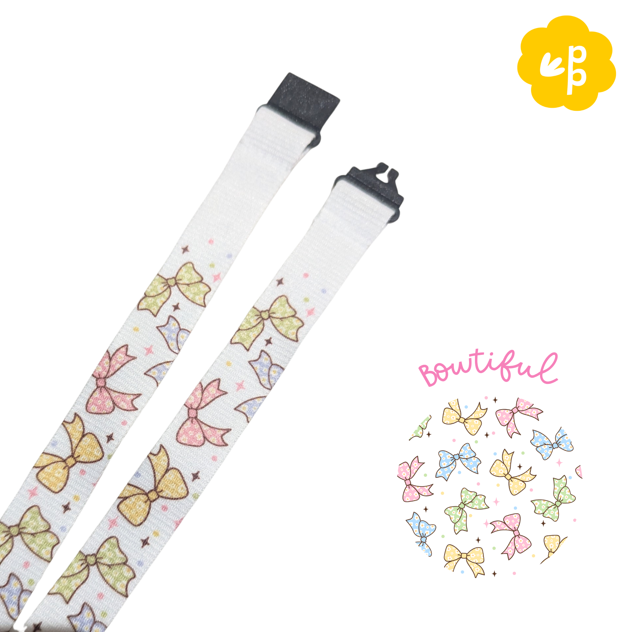 teacher lanyard with colorful bow pattern on a white background, featuring the brand logo in the corner and a black breakaway clasp.