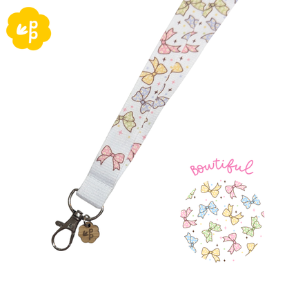 teacher Lanyard with colorful bow pattern on a white background and a silver clasp