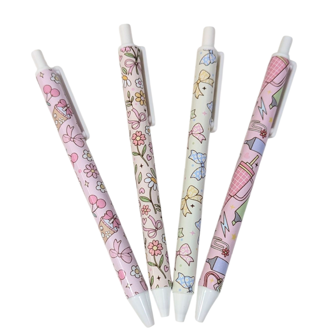 Set of four vinyl wrapped pens with pastel bow and floral designs, handmade cute stationery by Priority Play.