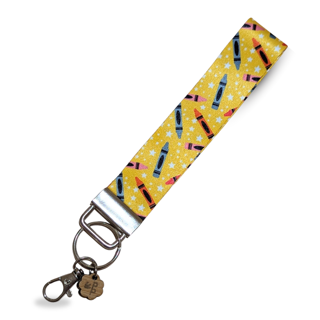 Yellow wristlet keychain with crayon print, handmade and perfect as a colorful teacher gift.