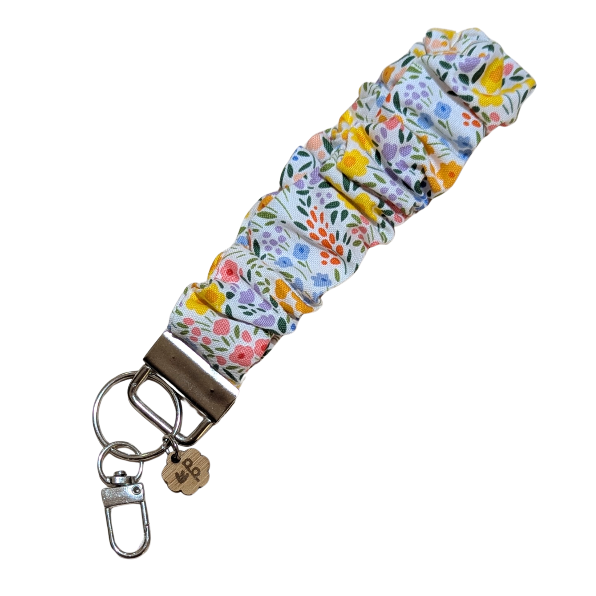 Handmade scrunchie wristlet keychain with yellow and pink floral fabric — cute and practical teacher gift idea.